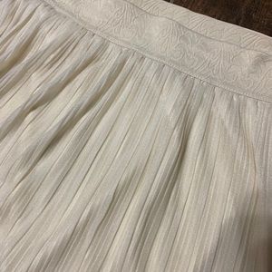 A-line midi pleated skirt. Ivory or cream colored